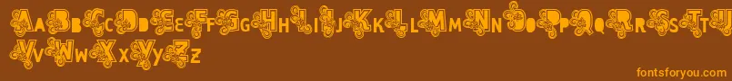 Vtks Caps Loco-Schriftart – Orangefarbene Schriften auf braunem Hintergrund
