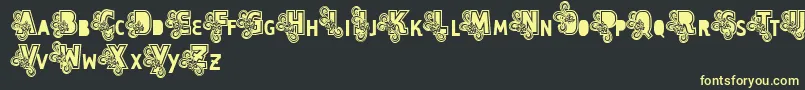 Шрифт Vtks Caps Loco – жёлтые шрифты на чёрном фоне