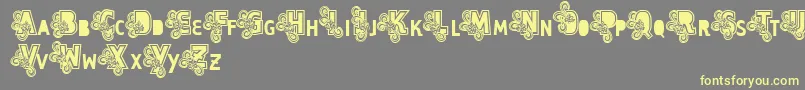 Vtks Caps Loco Font – Yellow Fonts on Gray Background