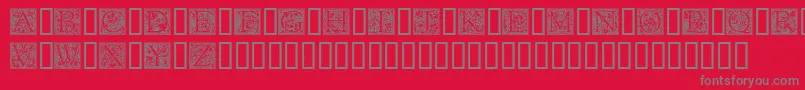 フォントGoudyInitialen – 赤い背景に灰色の文字