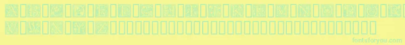 フォントGoudyInitialen – 黄色い背景に緑の文字