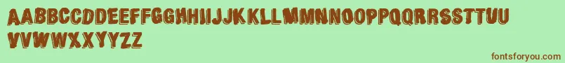 AgainstModernFootball-Schriftart – Braune Schriften auf grünem Hintergrund