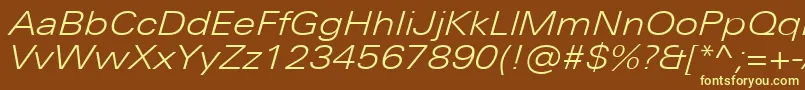 UniversNextProLightExtendedItalic-fontti – keltaiset fontit ruskealla taustalla