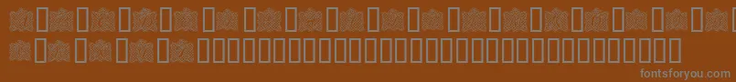RibbonCaps Font – Gray Fonts on Brown Background