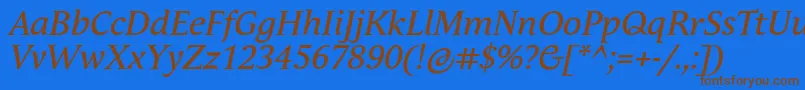 フォントAndulkaTextProItalic – 茶色の文字が青い背景にあります。