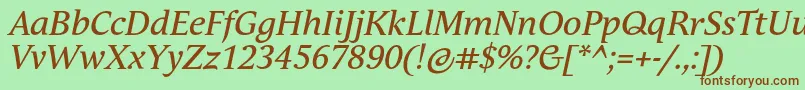 フォントAndulkaTextProItalic – 緑の背景に茶色のフォント