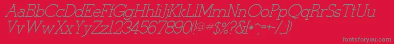 StymieItalicItalic-fontti – harmaat kirjasimet punaisella taustalla