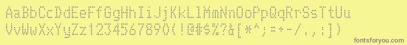 Telidon-fontti – harmaat kirjasimet keltaisella taustalla