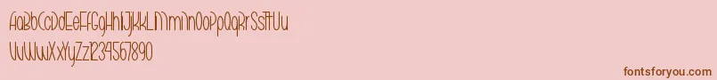 Fonte MarikoChanThin – fontes marrons em um fundo rosa