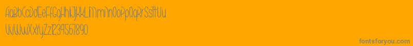 MarikoChanThin-Schriftart – Graue Schriften auf orangefarbenem Hintergrund