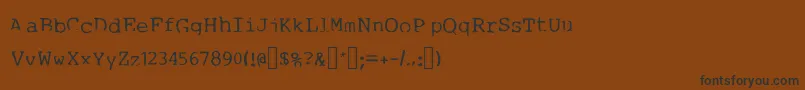 フォント1980swriter – 黒い文字が茶色の背景にあります
