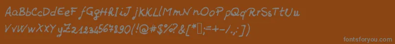 フォントJdHands – 茶色の背景に灰色の文字