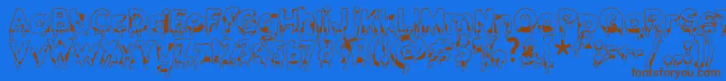 Gooeydrippysticky-Schriftart – Braune Schriften auf blauem Hintergrund