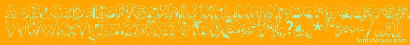 Gooeydrippysticky-Schriftart – Grüne Schriften auf orangefarbenem Hintergrund