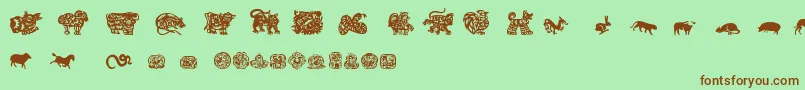 フォントChineseZodiacTfb – 緑の背景に茶色のフォント