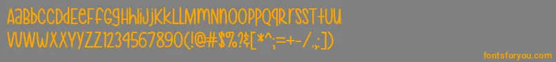 フォントMfHeyPrettyGirl – オレンジの文字は灰色の背景にあります。