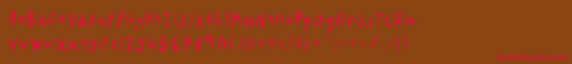 フォントPfkidsproGradethree – 赤い文字が茶色の背景にあります。