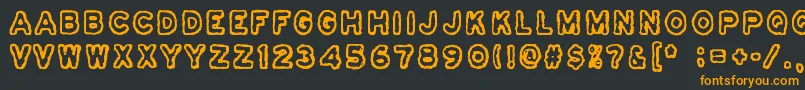 フォントOsasto329Suljettu – 黒い背景にオレンジの文字