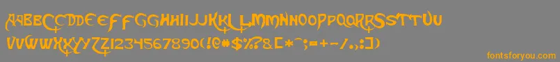 フォントSkeksisNormal – オレンジの文字は灰色の背景にあります。