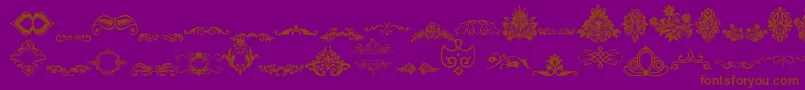Czcionka VintageDecorativeSigns – brązowe czcionki na fioletowym tle