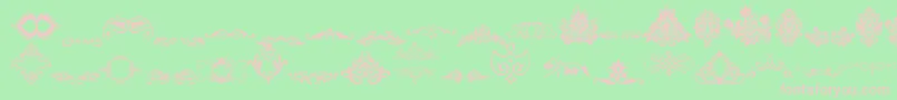 フォントVintageDecorativeSigns – 緑の背景にピンクのフォント
