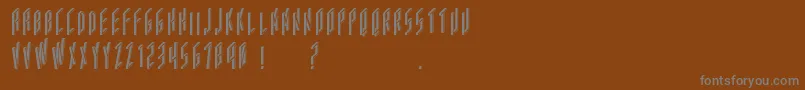 フォントAcframed – 茶色の背景に灰色の文字
