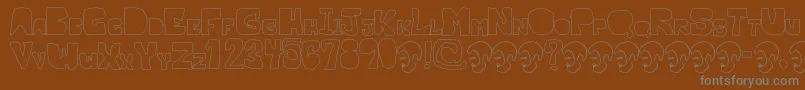 OpnMalatashitoNaked-Schriftart – Graue Schriften auf braunem Hintergrund