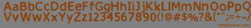 Finitimusiungo-Schriftart – Braune Schriften auf grauem Hintergrund