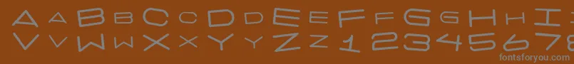 フォント7 Days Rotated – 茶色の背景に灰色の文字