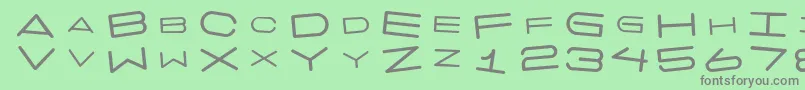 フォント7 Days Rotated – 緑の背景に灰色の文字