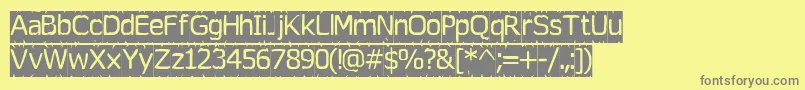 Tearoff-fontti – harmaat kirjasimet keltaisella taustalla