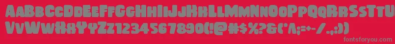 Fonte Rubberboybold – fontes cinzas em um fundo vermelho