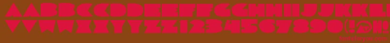 フォントSortadeco – 赤い文字が茶色の背景にあります。