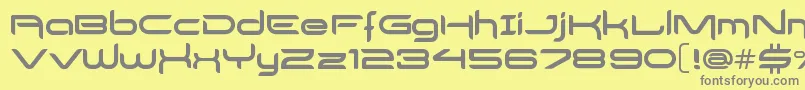 DelogsGoesHiTech-fontti – harmaat kirjasimet keltaisella taustalla