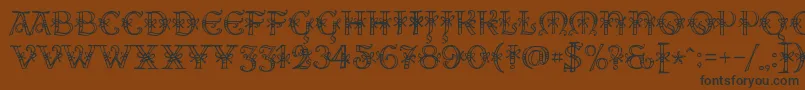 AlesHegarR18-fontti – mustat fontit ruskealla taustalla