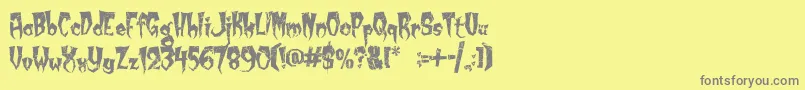 Fonte KreepyKrawly – fontes cinzas em um fundo amarelo
