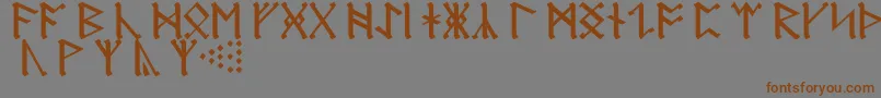 フォントAnglosaxonRunes – 茶色の文字が灰色の背景にあります。