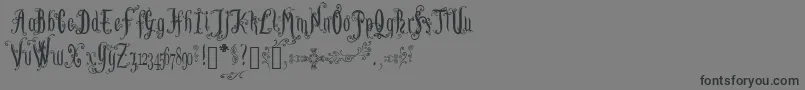 フォントLutinPaniquangoisse – 黒い文字の灰色の背景