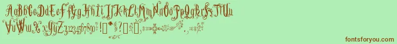 フォントLutinPaniquangoisse – 緑の背景に茶色のフォント