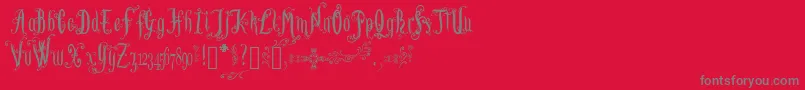 LutinPaniquangoisse-Schriftart – Graue Schriften auf rotem Hintergrund