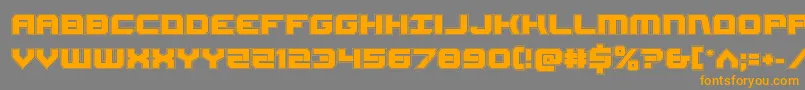 フォントGearheadacad – オレンジの文字は灰色の背景にあります。