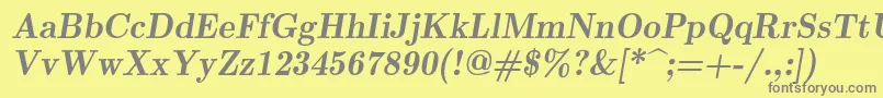 Lmromandemi10Oblique-fontti – harmaat kirjasimet keltaisella taustalla