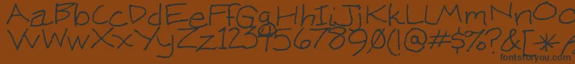 KenWeigand Font – Black Fonts on Brown Background
