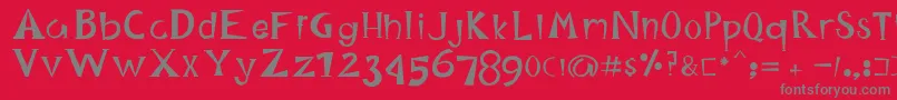 HappyKing-fontti – harmaat kirjasimet punaisella taustalla