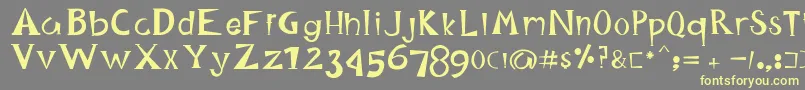 HappyKing Font – Yellow Fonts on Gray Background