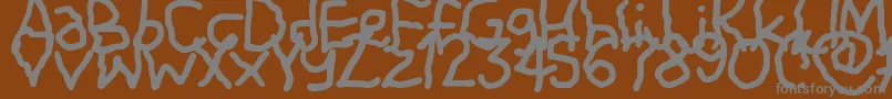 Shiver-Schriftart – Graue Schriften auf braunem Hintergrund