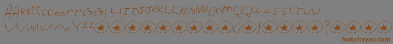 フォントTommysFirstAlphabet – 茶色の文字が灰色の背景にあります。