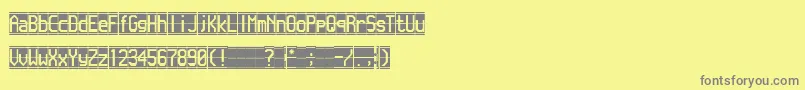 フォントFlappen – 黄色の背景に灰色の文字