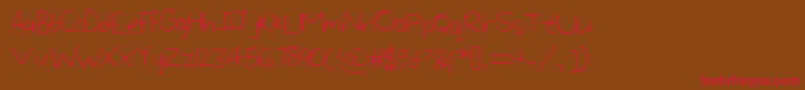 Czcionka LargeHandwriting – czerwone czcionki na brązowym tle
