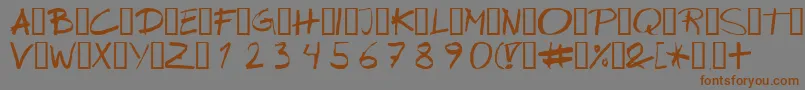 フォントWipeout – 茶色の文字が灰色の背景にあります。